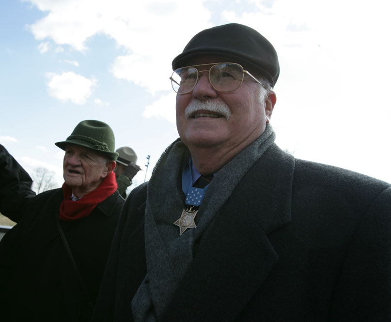 Iwo Jima veteran Capt Cyril O’Brien, USMC (Ret) was greeted by those who attended the ceremony, including Medal of Honor Marine Col Harvey C. “Barney” Barnum (on right). 